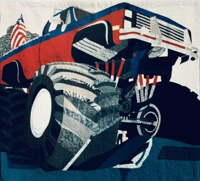 This monster truck quilt is in the permanent collection of the San Jose Museum of Quilts and Testiles, San Jose California