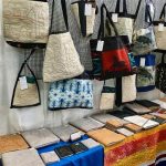Gallery 10 - books and bags and quilts at a show booth